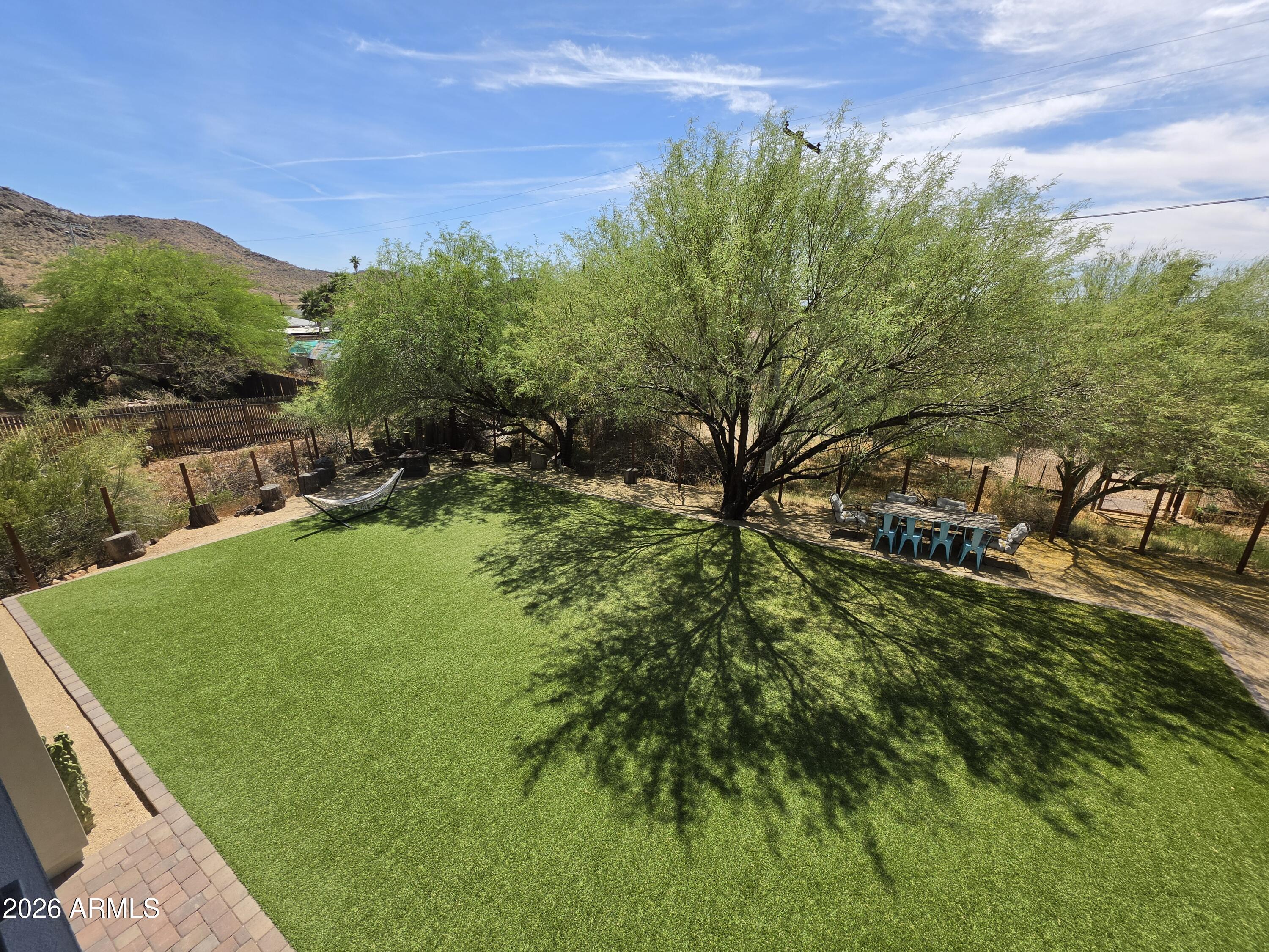 933 West Mercer Lane Phoenix, AZ 85029 - Photo 36 of 46 a backyard of a house with lots of green space