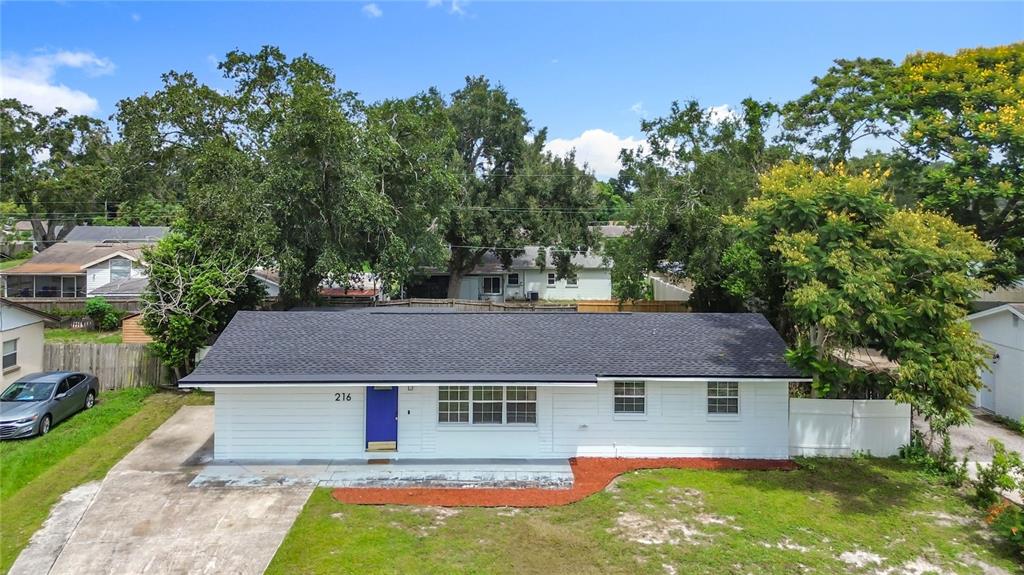 216 Obrien Road Casselberry, FL 32730 - Photo 1 of 22 a aerial view of a house with a yard table and chairs