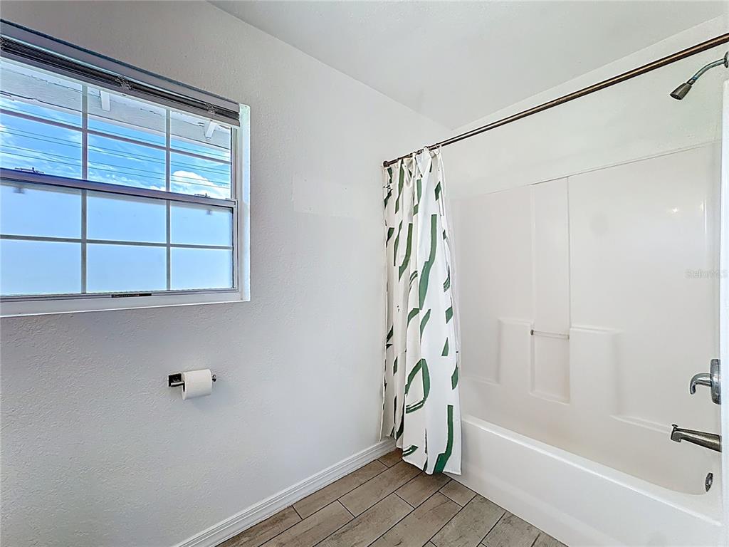 216 Obrien Road Casselberry, FL 32730 - Photo 13 of 22 a bathroom with a bathtub and a shower