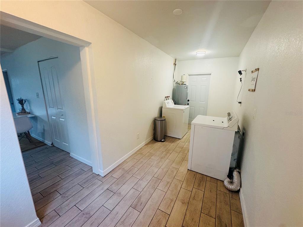 216 Obrien Road Casselberry, FL 32730 - Photo 16 of 22 a view of a room with wooden floor and a sink