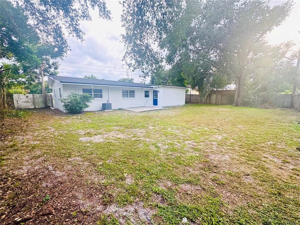 216 Obrien Road Casselberry, FL 32730 - Photo 19 of 22 a view of a house with a yard and garage