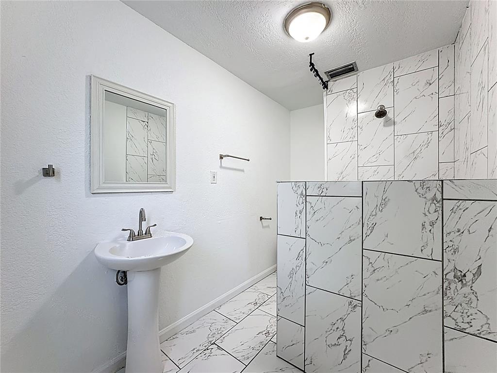 216 Obrien Road Casselberry, FL 32730 - Photo 10 of 22 a bathroom with a sink and mirror