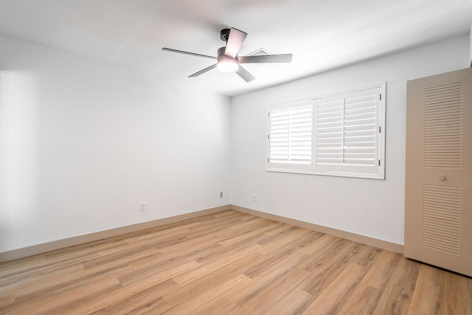 5739 West Monte Vista Road Phoenix, AZ 85035 - Photo 16 of 23 wooden floor in an empty room with a window