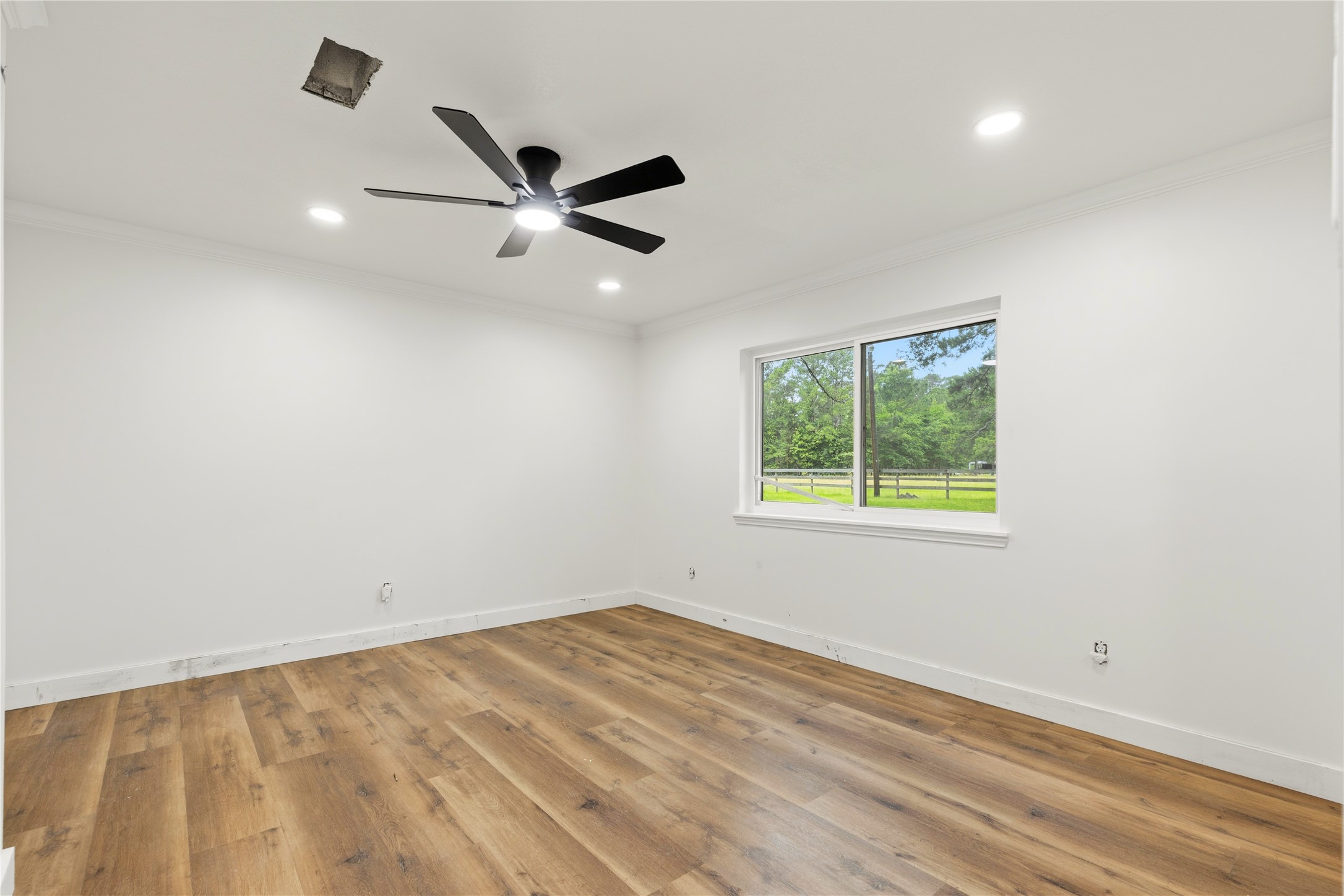 74 Robinson Road Huntsville, TX 77320 - Photo 23 of 33 an empty room with a window