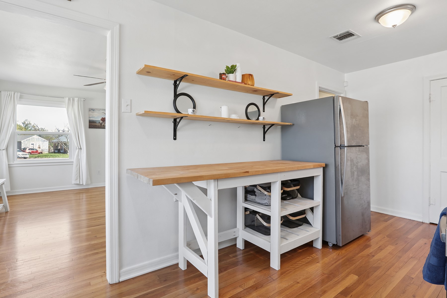2210 Monticello Road Temple, TX 76501 - Photo 20 of 34 Kitchen featuring wood counters, freestanding refrigerator, light wood-style flooring, and open shelves