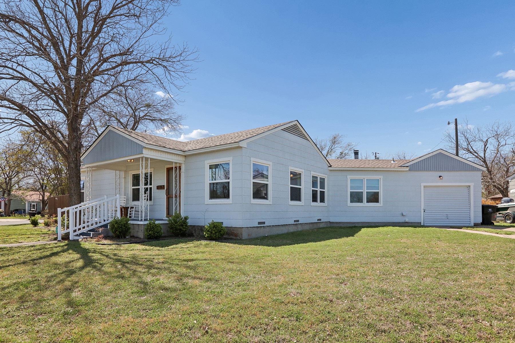 2210 Monticello Road Temple, TX 76501 - Photo 26 of 34 View of front facade with a front lawn, an attached garage, covered porch, crawl space, and a shingled roof