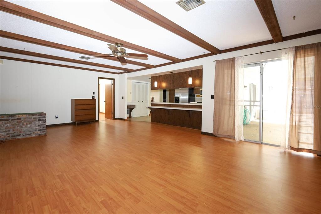 504 Ridgewood Street Altamonte Springs, FL 32701 - Photo 12 of 51 a view of empty room with wooden floor and windows