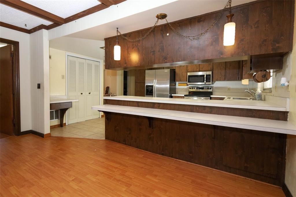 504 Ridgewood Street Altamonte Springs, FL 32701 - Photo 13 of 51 a large kitchen with stainless steel appliances a large counter top