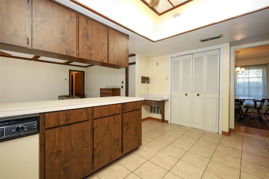 504 Ridgewood Street Altamonte Springs, FL 32701 - Photo 18 of 51 a kitchen with stainless steel appliances a sink cabinets and a window