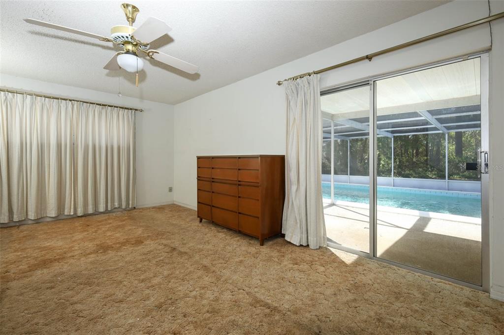 504 Ridgewood Street Altamonte Springs, FL 32701 - Photo 19 of 51 an empty room with windows and fan