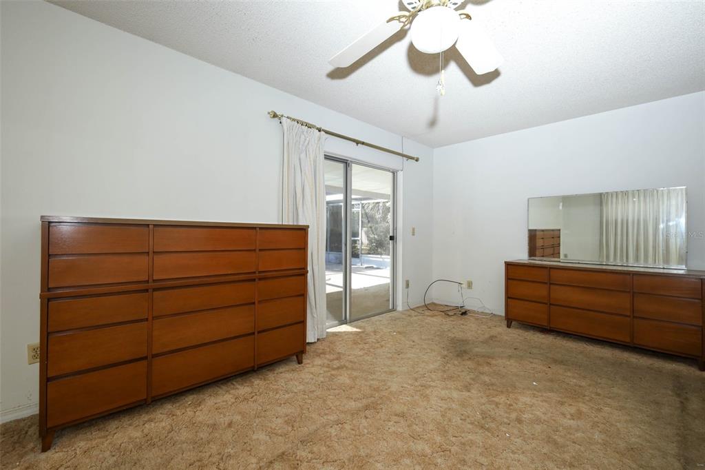 504 Ridgewood Street Altamonte Springs, FL 32701 - Photo 20 of 51 a room with a bed and a dresser