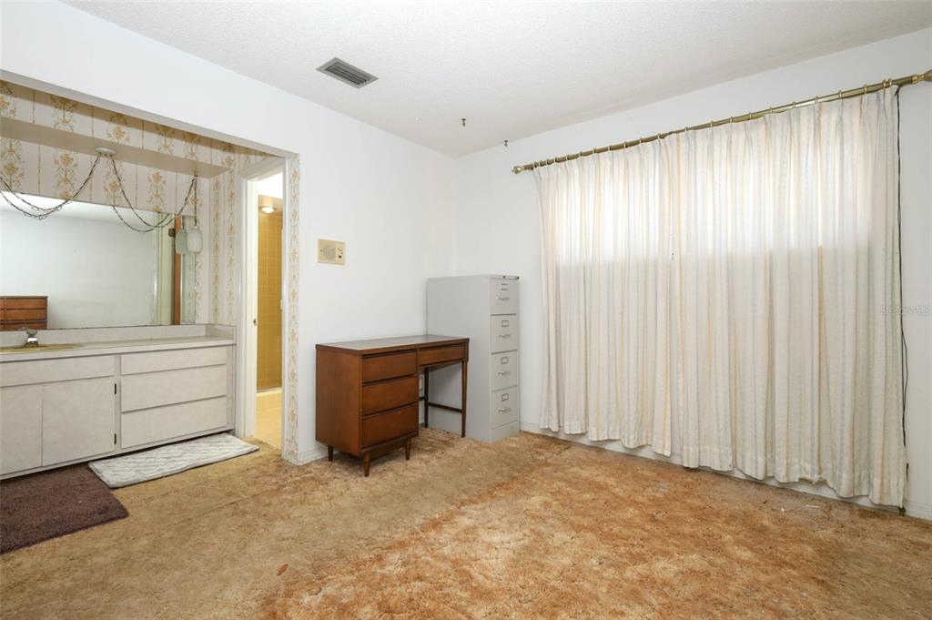 504 Ridgewood Street Altamonte Springs, FL 32701 - Photo 21 of 51 a room with furniture and a window