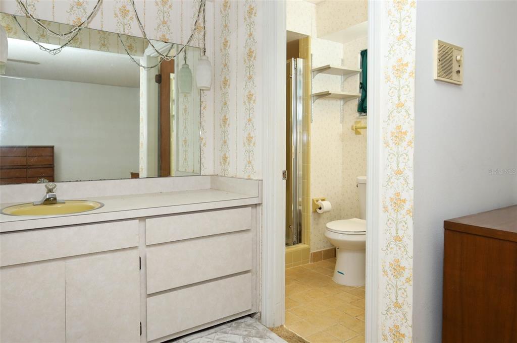 504 Ridgewood Street Altamonte Springs, FL 32701 - Photo 22 of 51 a bathroom with a granite countertop sink toilet and shower