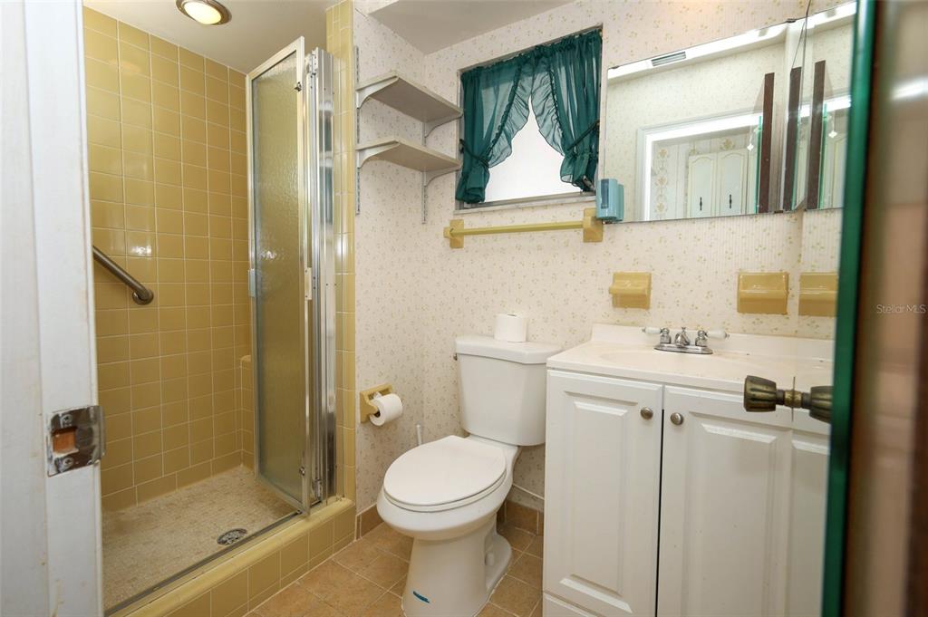 504 Ridgewood Street Altamonte Springs, FL 32701 - Photo 23 of 51 a bathroom with a toilet sink and shower