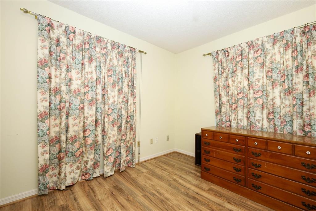 504 Ridgewood Street Altamonte Springs, FL 32701 - Photo 26 of 51 a view of wooden floor and closet in a room