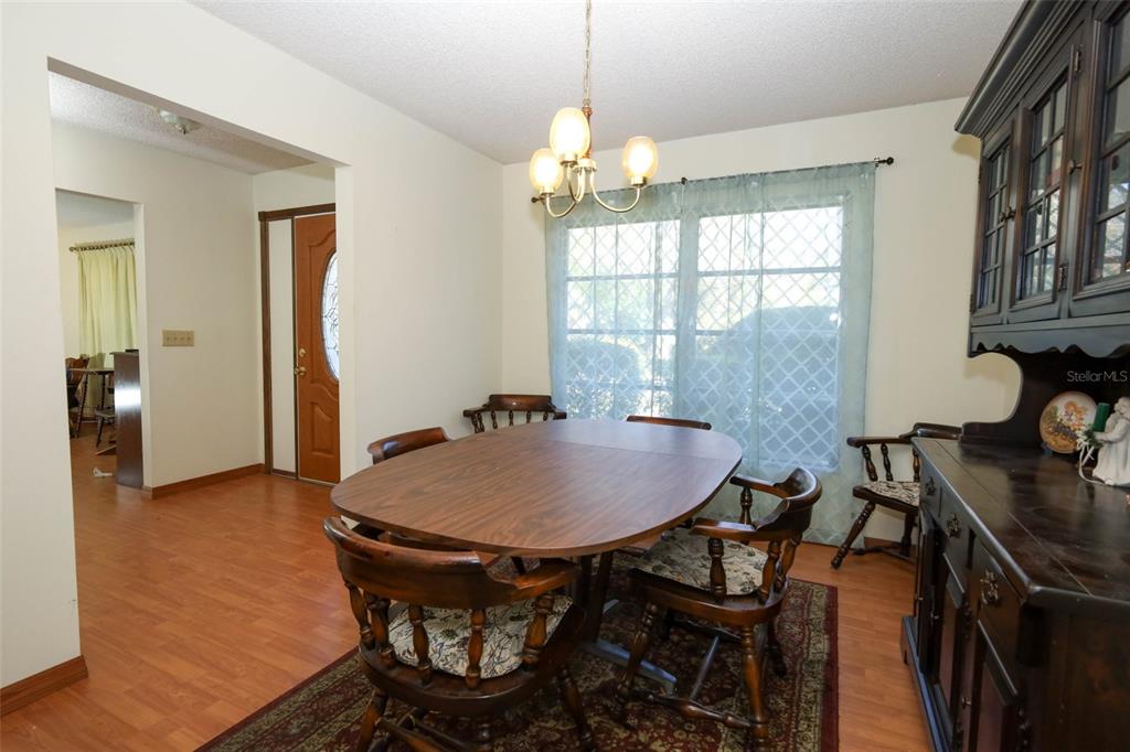 504 Ridgewood Street Altamonte Springs, FL 32701 - Photo 6 of 51 a dining room with furniture and window