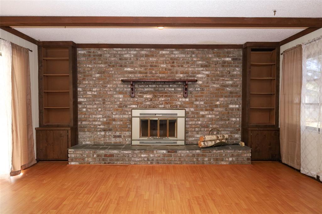 504 Ridgewood Street Altamonte Springs, FL 32701 - Photo 9 of 51 a view of empty room with fireplace and windows