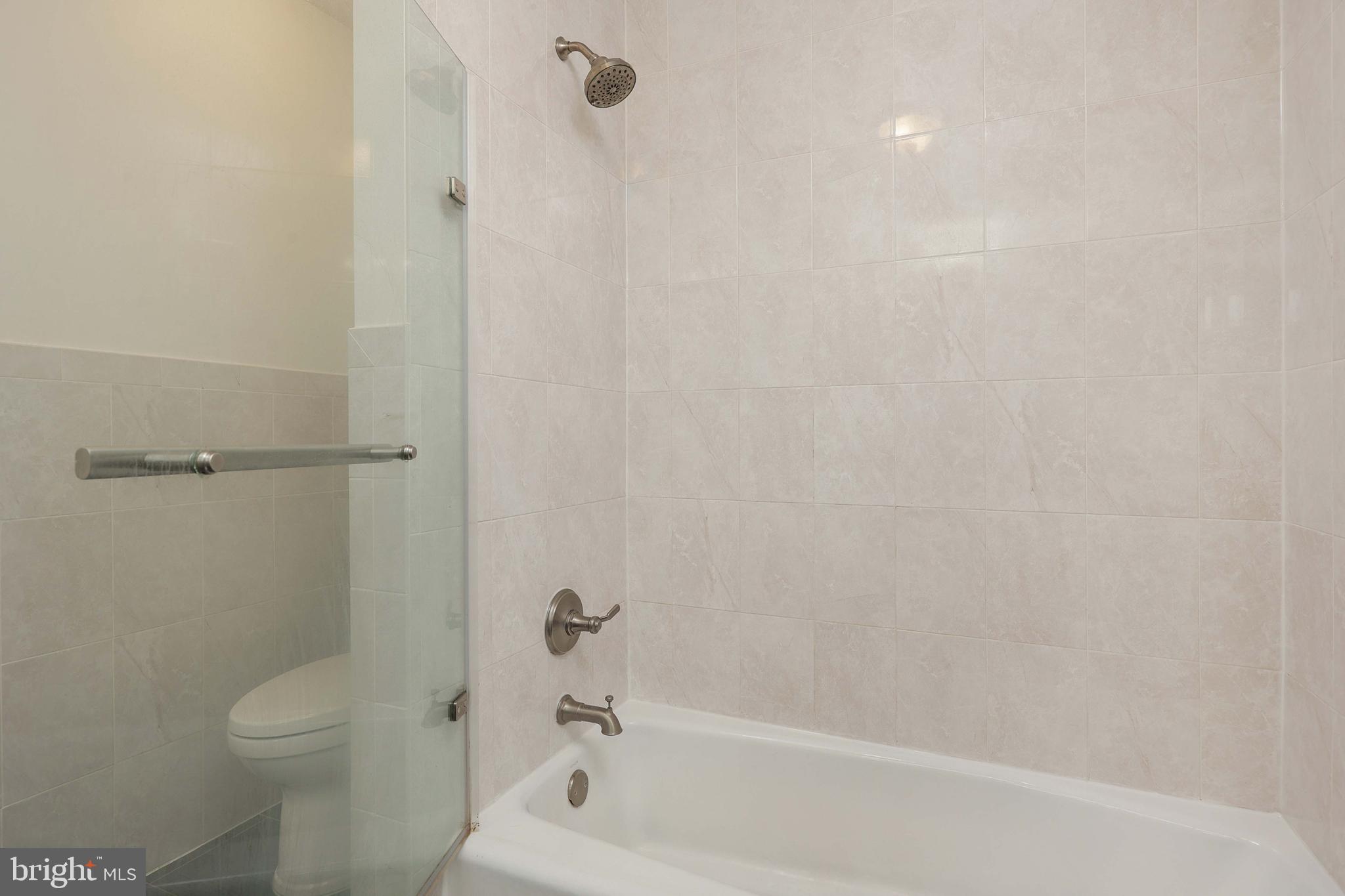 357 Dodds Lane Princeton, NJ 08540 - Photo 18 of 41 a bathroom with a bathtub and a toilet