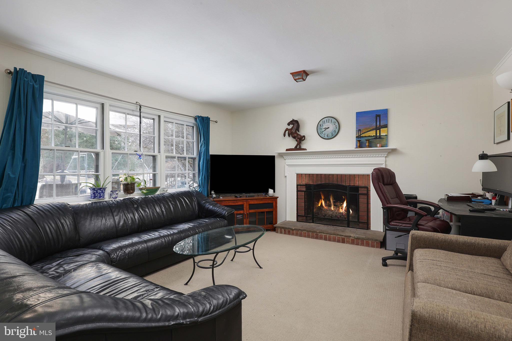 357 Dodds Lane Princeton, NJ 08540 - Photo 19 of 41 a living room with furniture a window and a fireplace