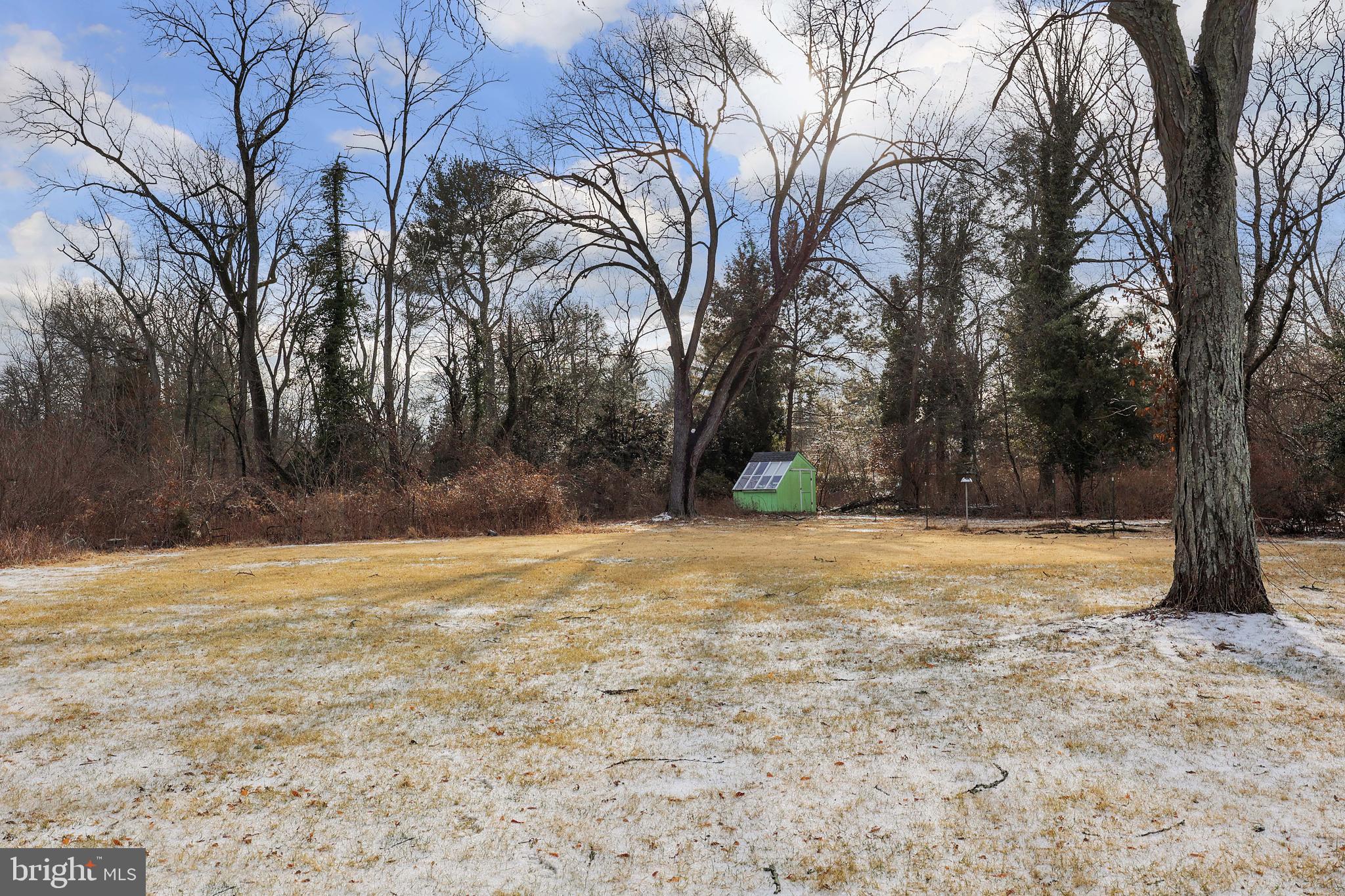 357 Dodds Lane Princeton, NJ 08540 - Photo 35 of 41 a house with trees in front of it