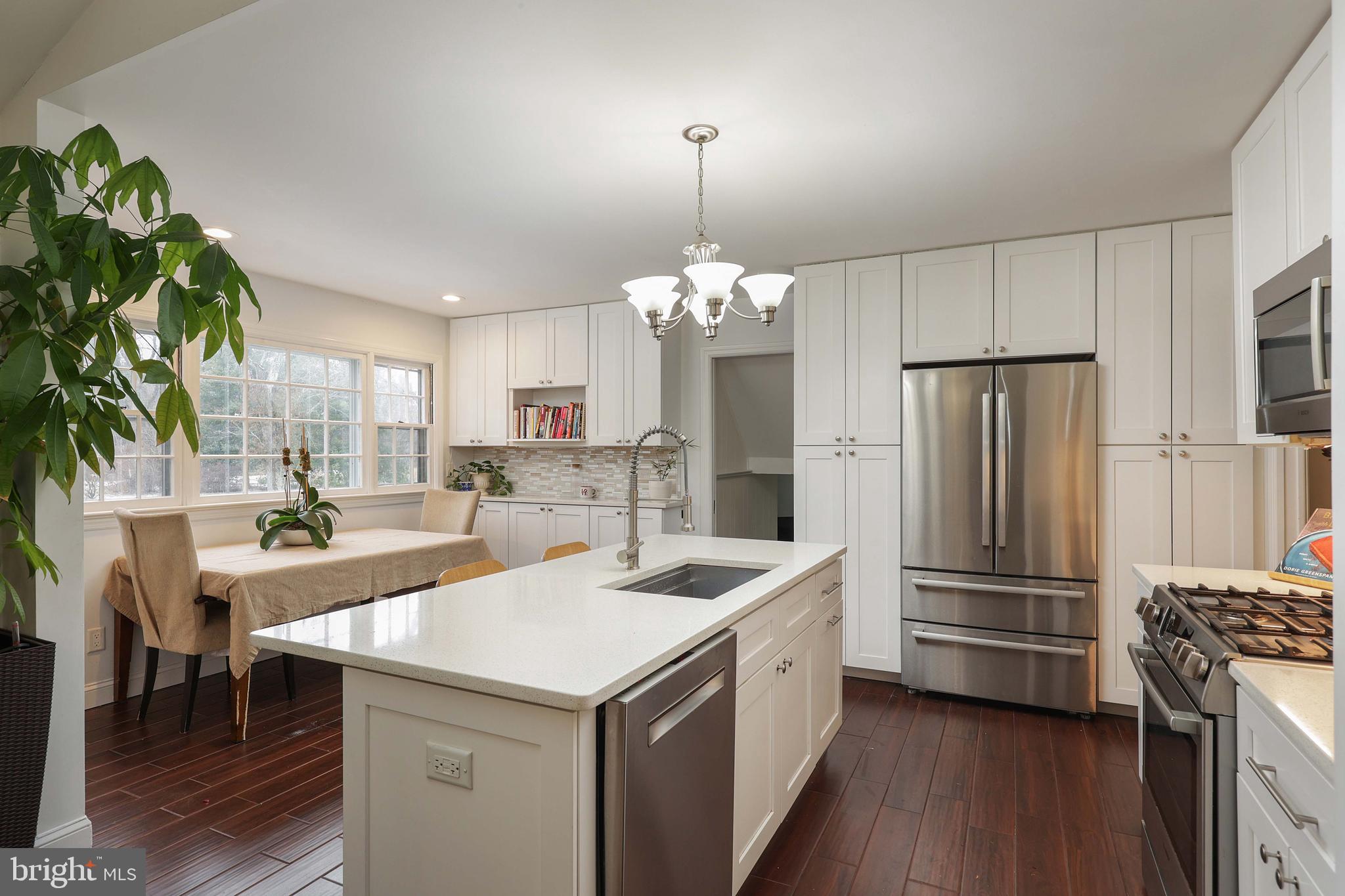 357 Dodds Lane Princeton, NJ 08540 - Photo 7 of 41 a kitchen that has a lot of cabinets a sink and a stove in it
