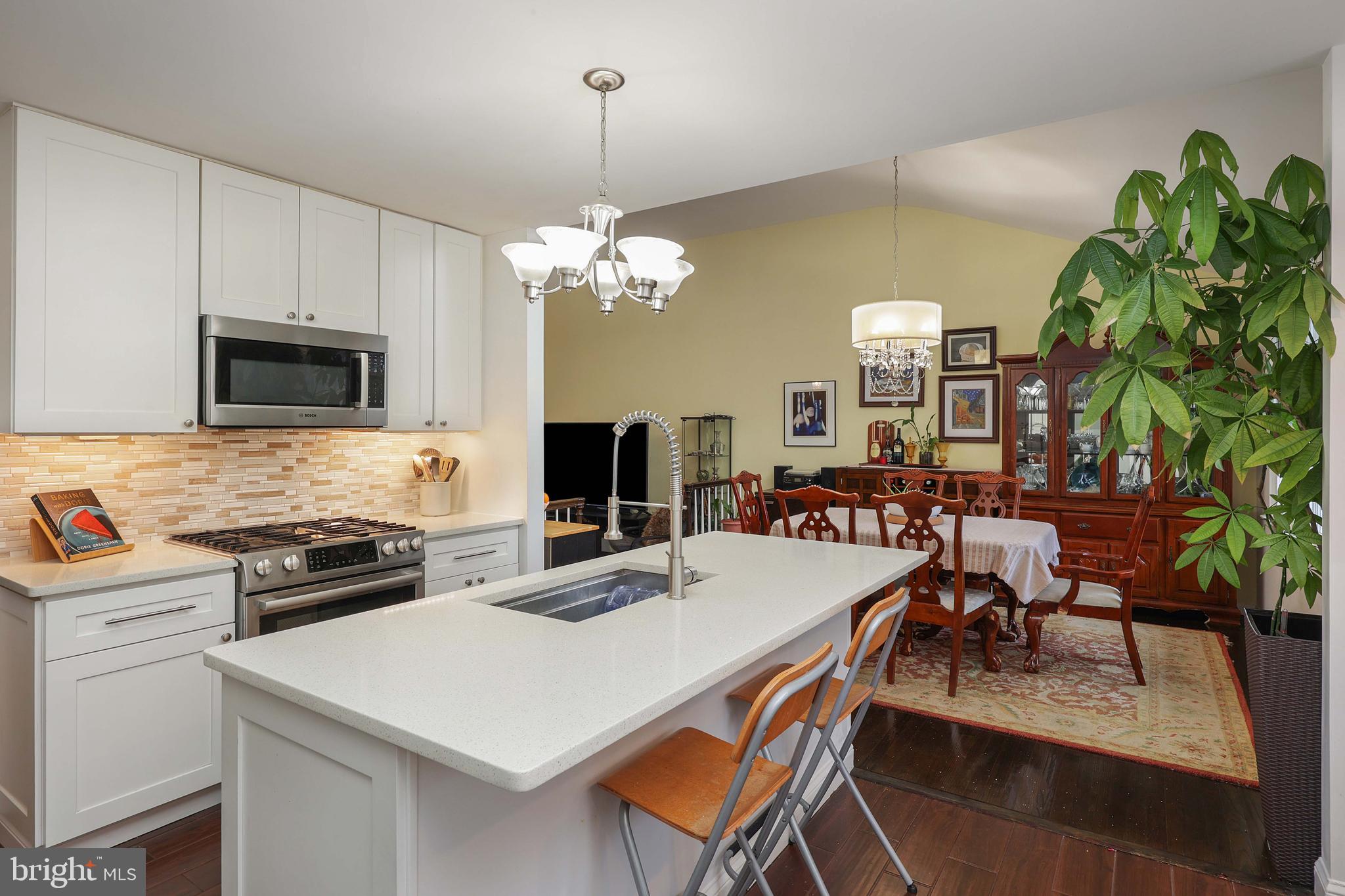 357 Dodds Lane Princeton, NJ 08540 - Photo 8 of 41 a kitchen that has a table chairs and white cabinets