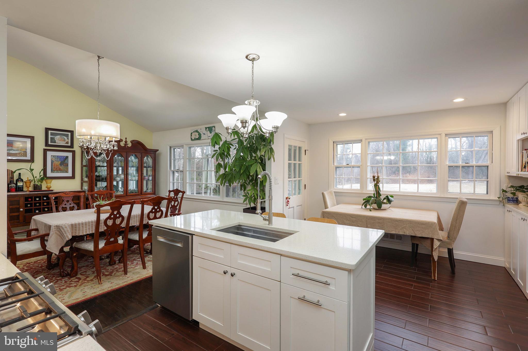 357 Dodds Lane Princeton, NJ 08540 - Photo 9 of 41 a kitchen with a table chairs and white cabinets