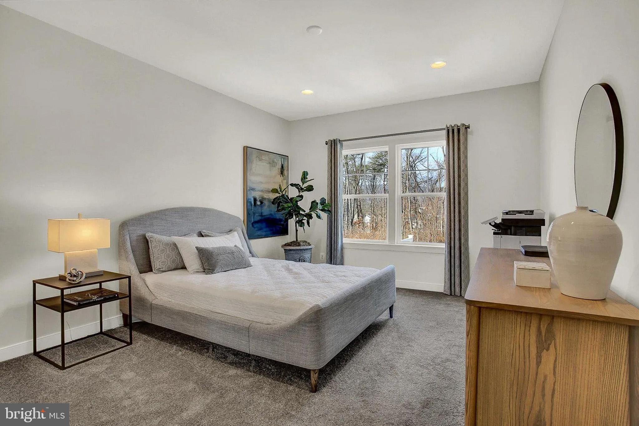 Tbd Tbd White Spruce Way Conowingo, MD 21918 - Photo 3 of 23 a spacious bedroom with a bed and wooden floor