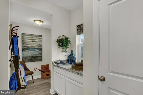 a dining room with furniture a rug and a chandelier