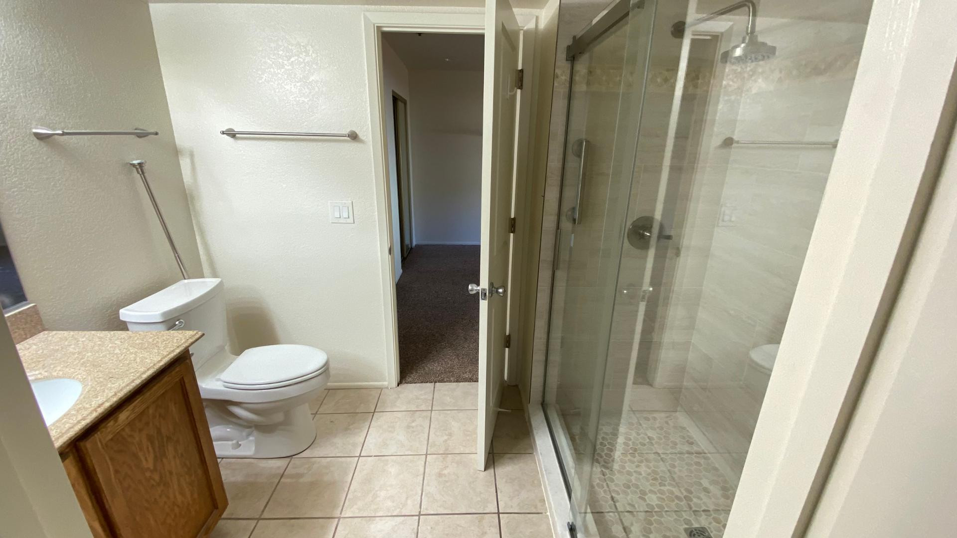 154 West 5th Street, Unit 242 Tempe, AZ 85281 - Photo 19 of 27 a bathroom with a toilet and a shower