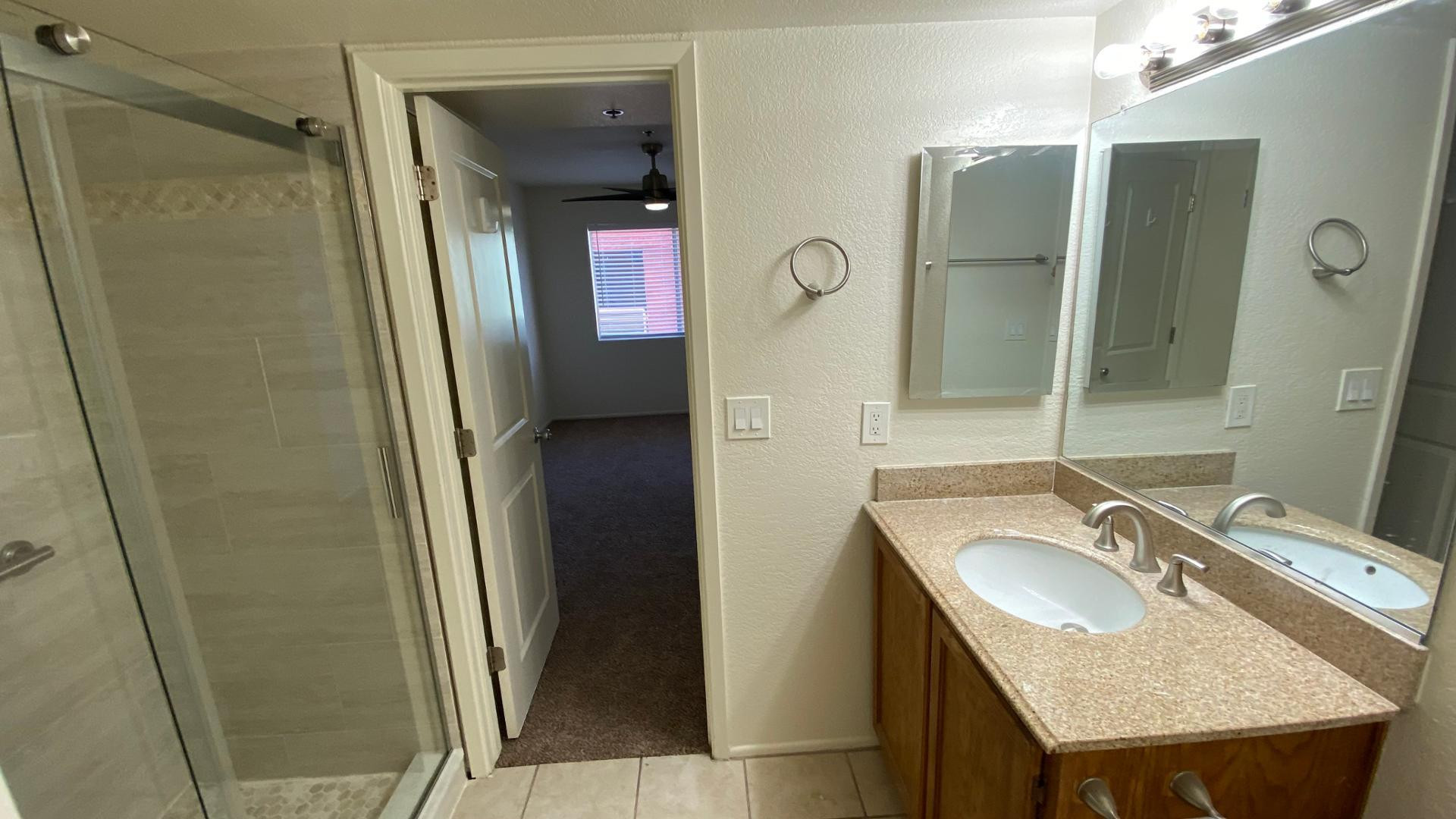 154 West 5th Street, Unit 242 Tempe, AZ 85281 - Photo 20 of 27 a bathroom with a sink and a mirror