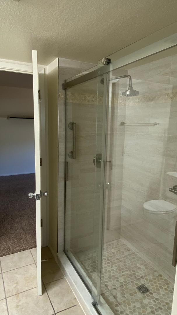 154 West 5th Street, Unit 242 Tempe, AZ 85281 - Photo 23 of 27 a bathroom with a shower and a sink