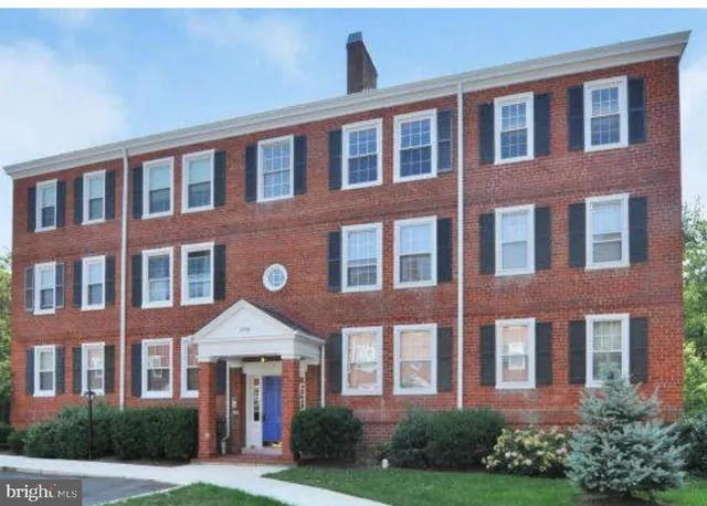 a front view of a building with garden