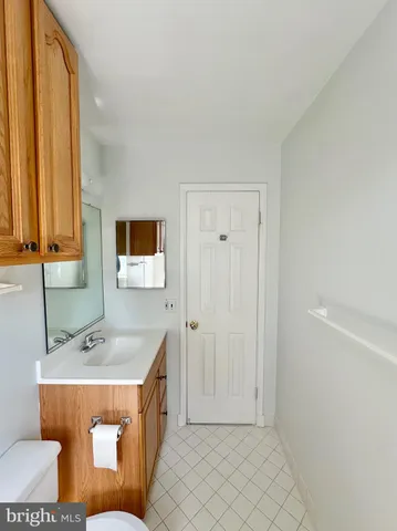 a bathroom with a sink a mirror and a bathtub