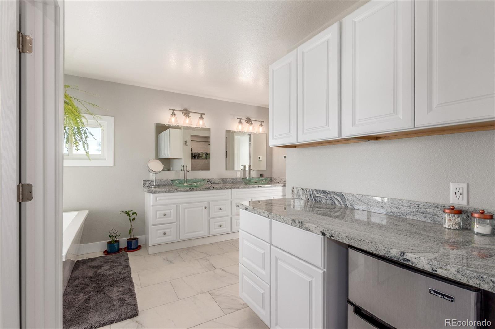15528 Nancy Avenue Fort Lupton, CO 80621 - Photo 16 of 35 a kitchen with sink cabinets and window