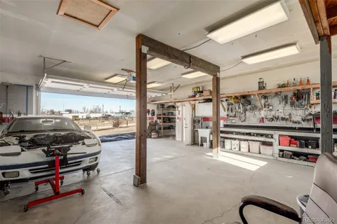 a view of a kitchen with a sink and cabinets