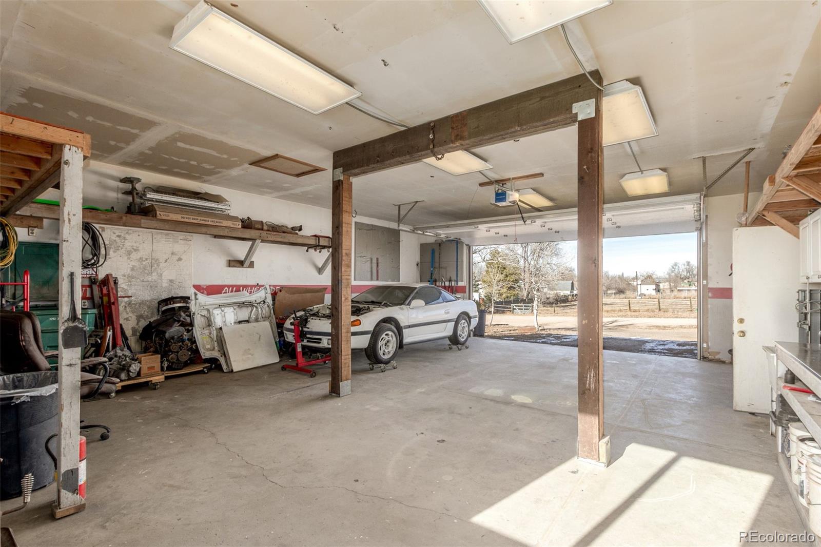 15528 Nancy Avenue Fort Lupton, CO 80621 - Photo 27 of 35 a view of a garage with cars