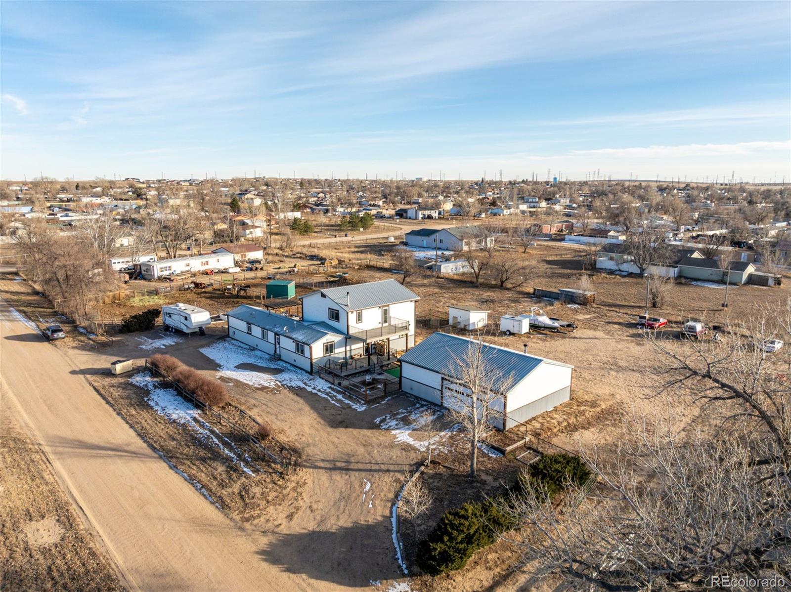 15528 Nancy Avenue Fort Lupton, CO 80621 - Photo 34 of 35 an aerial view of a city with lots of residential buildings
