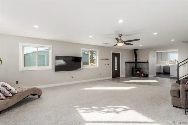 a spacious bedroom with a bed and a chandelier