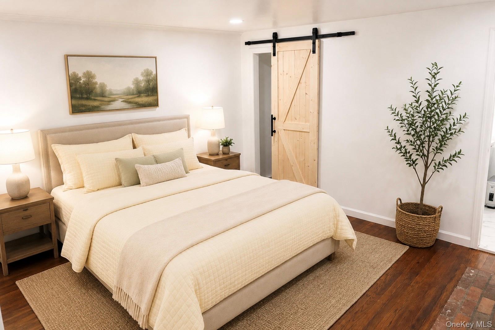 80 Mt Pleasant Road Smithtown, NY 11787 - Photo 10 of 27 a bedroom with a bed and a potted plant