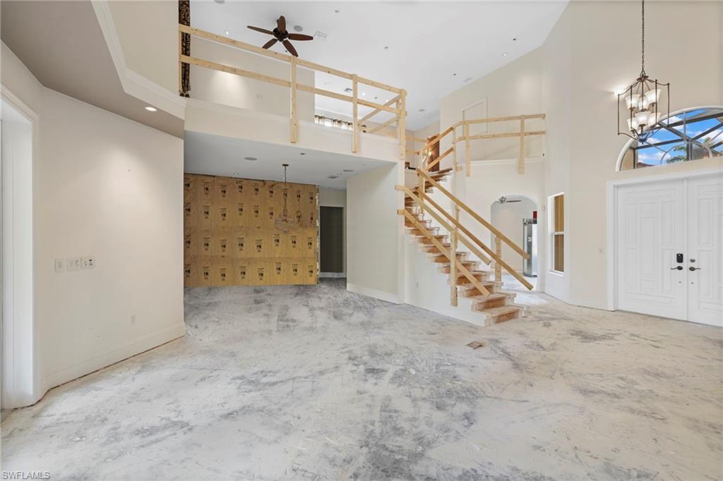 7834 Classics Drive Naples, FL 34113 - Photo 12 of 37 a view of an empty room with stairs