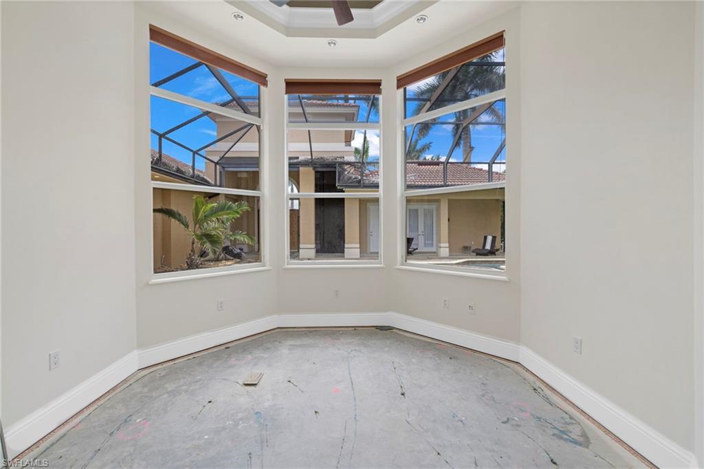 7834 Classics Drive Naples, FL 34113 - Photo 14 of 37 a view of an empty room with a window