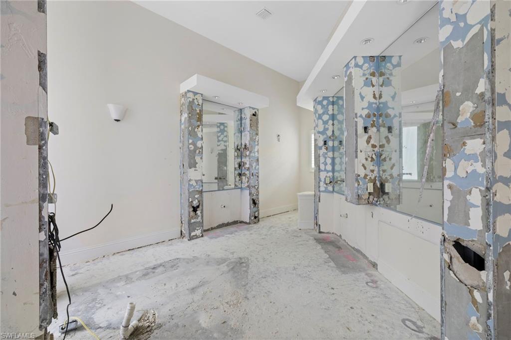 7834 Classics Drive Naples, FL 34113 - Photo 18 of 37 a view of a room with lots of wooden furniture