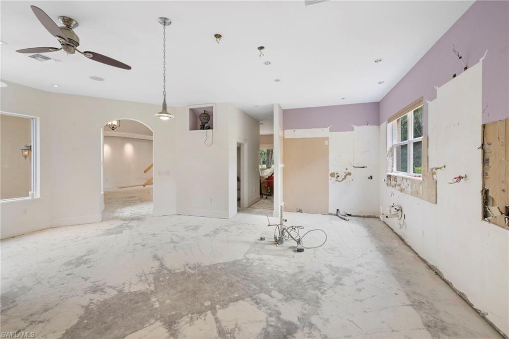 7834 Classics Drive Naples, FL 34113 - Photo 21 of 37 a view of a livingroom with wooden floor
