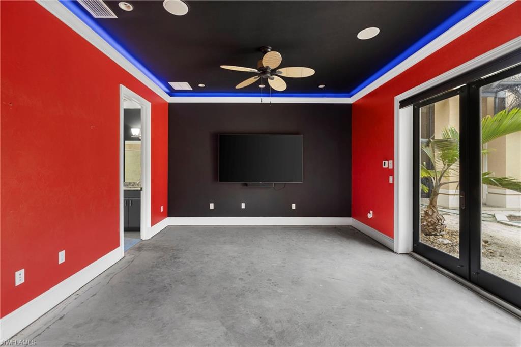 7834 Classics Drive Naples, FL 34113 - Photo 22 of 37 a view of an empty room with a ceiling fan and window