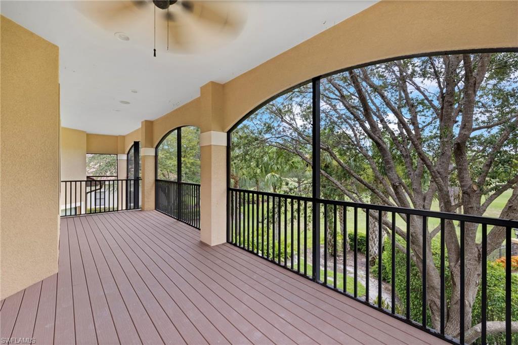 7834 Classics Drive Naples, FL 34113 - Photo 28 of 37 a view of a balcony with wooden floor