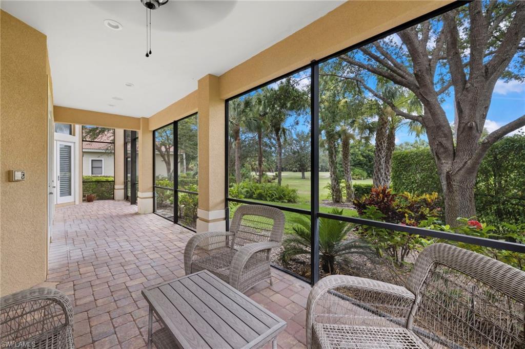 7834 Classics Drive Naples, FL 34113 - Photo 30 of 37 a view of a living room and a balcony