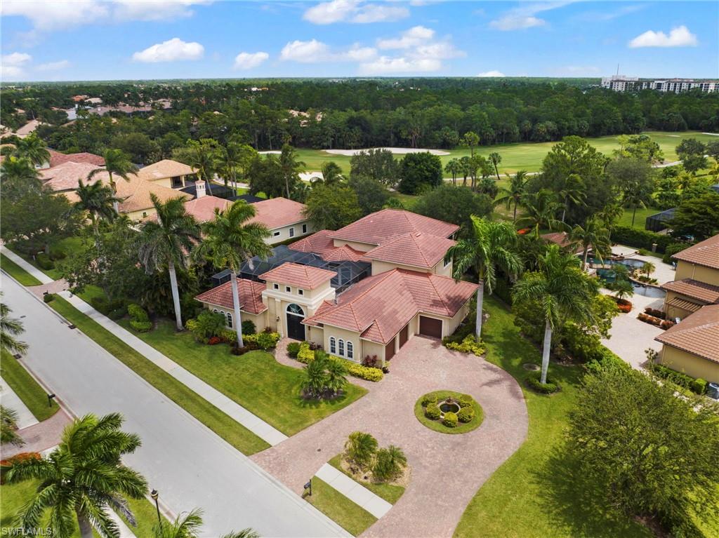 7834 Classics Drive Naples, FL 34113 - Photo 3 of 37 a view of lake with houses