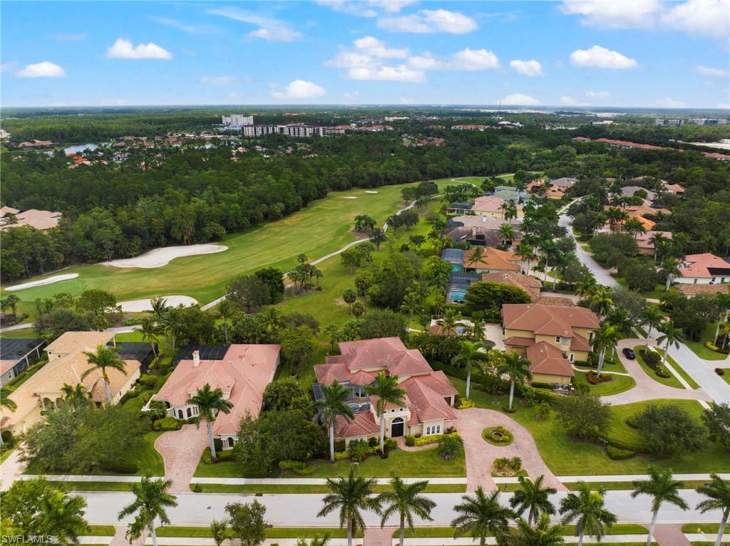 7834 Classics Drive Naples, FL 34113 - Photo 33 of 37 an aerial view of residential houses with outdoor space and river