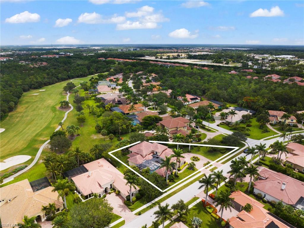 7834 Classics Drive Naples, FL 34113 - Photo 34 of 37 an aerial view of residential houses with outdoor space